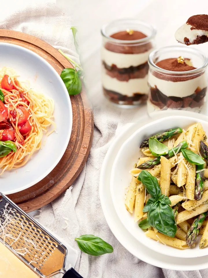 Spaghetti with tomato, penne with pesto and asparagus, and tiramisu in glass jars
